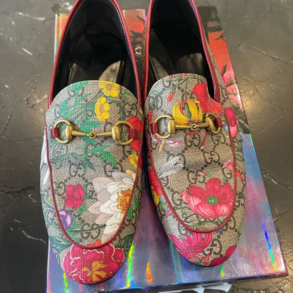 Gucci canvas floral horse bit loafers.